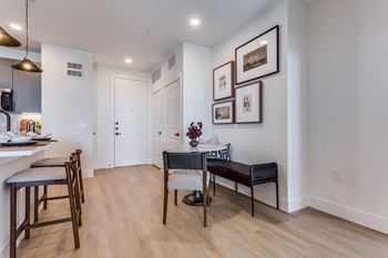 Wood-style flooring in living, dining, and bath areas
